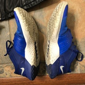Blue Nike training shoes